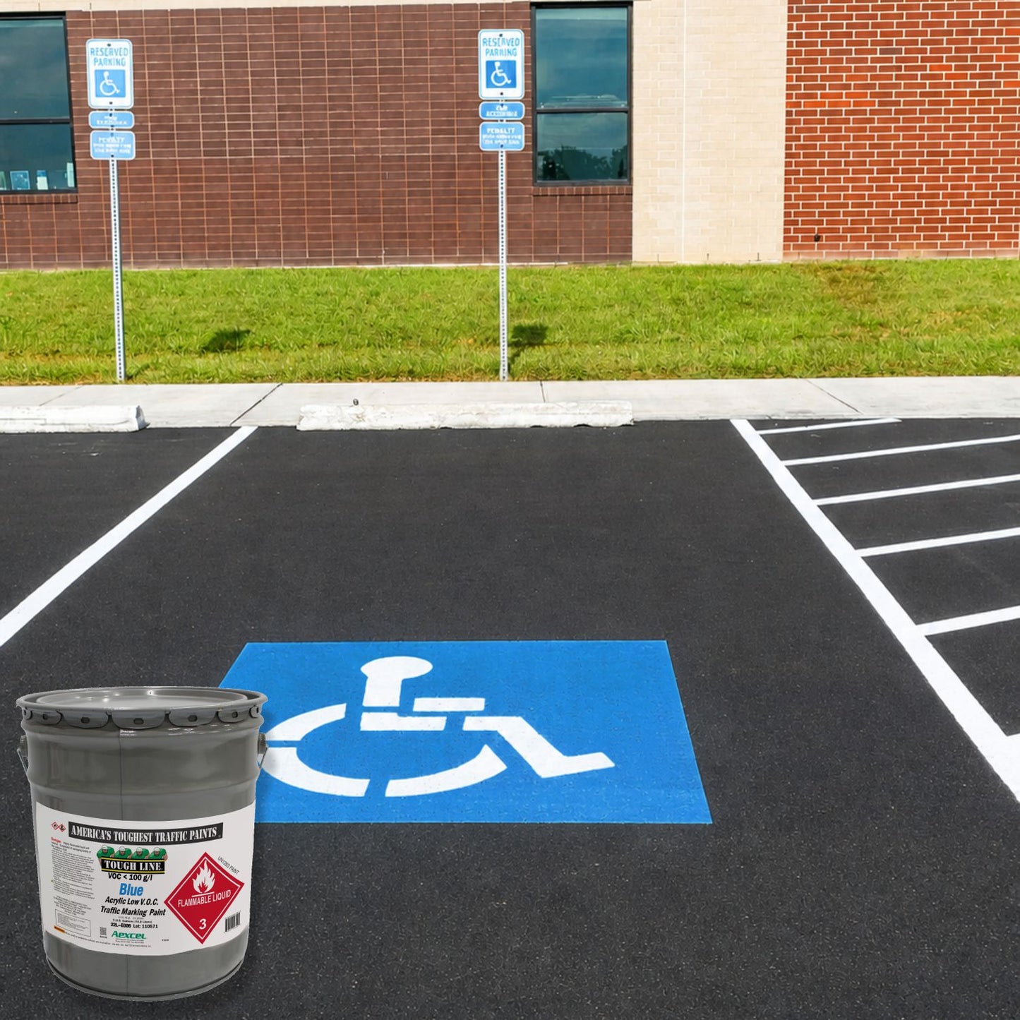 Blue ADA-accessible parking space symbol on freshly striped asphalt, created with Aexcel Acrylic Traffic Marking Paint for durable, high-visibility accessibility markings.