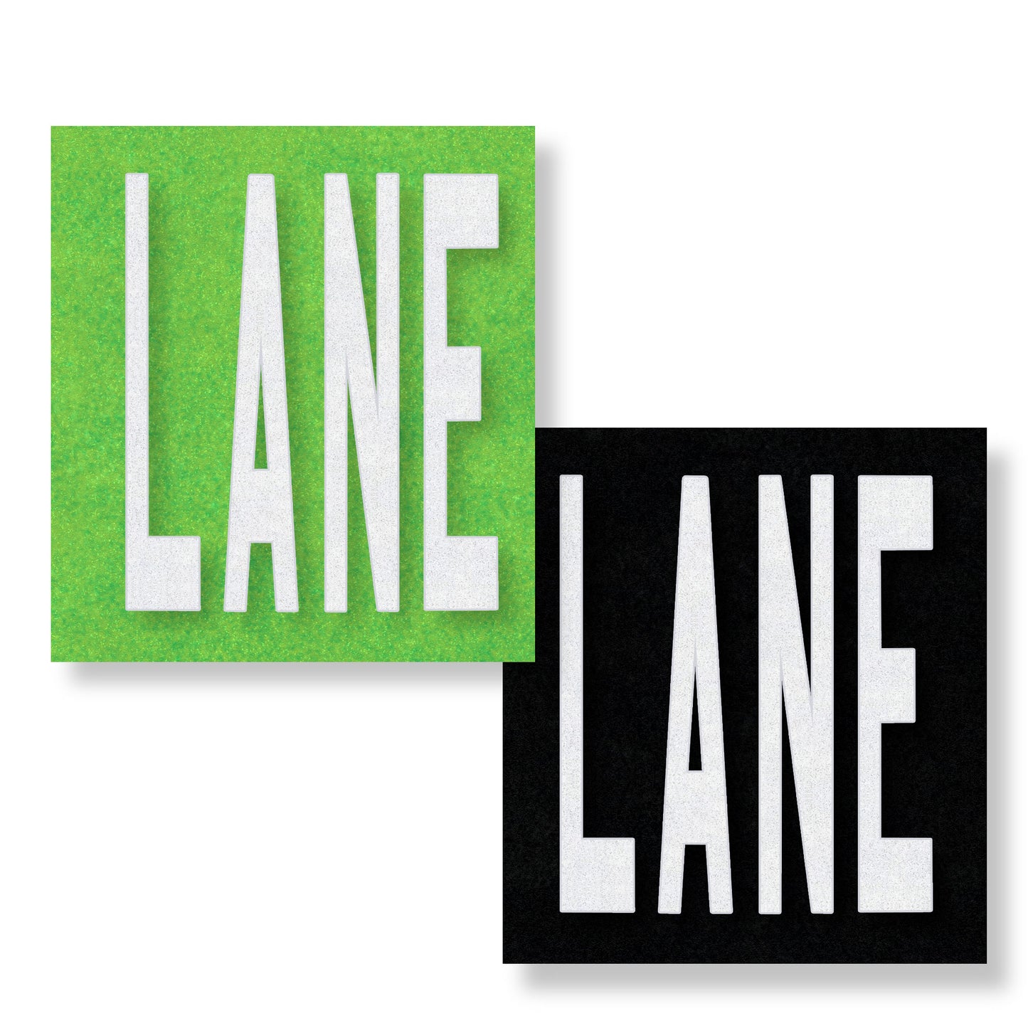 White preformed thermoplastic text LANE in all capital letters on green and black rectangles.