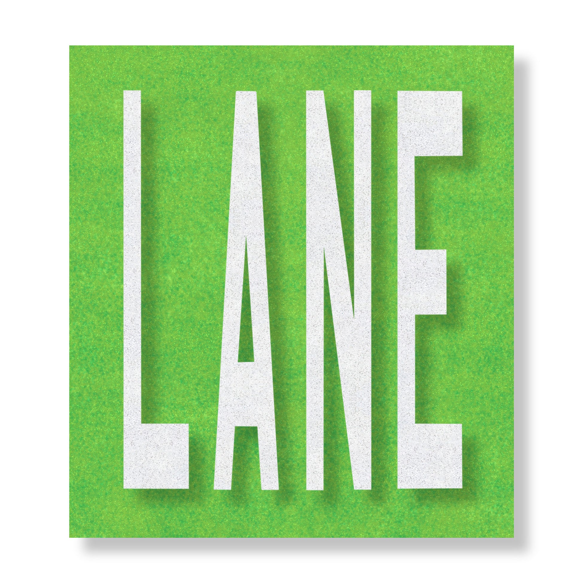 White preformed thermoplastic text LANE in all capital letters on a green rectangle.