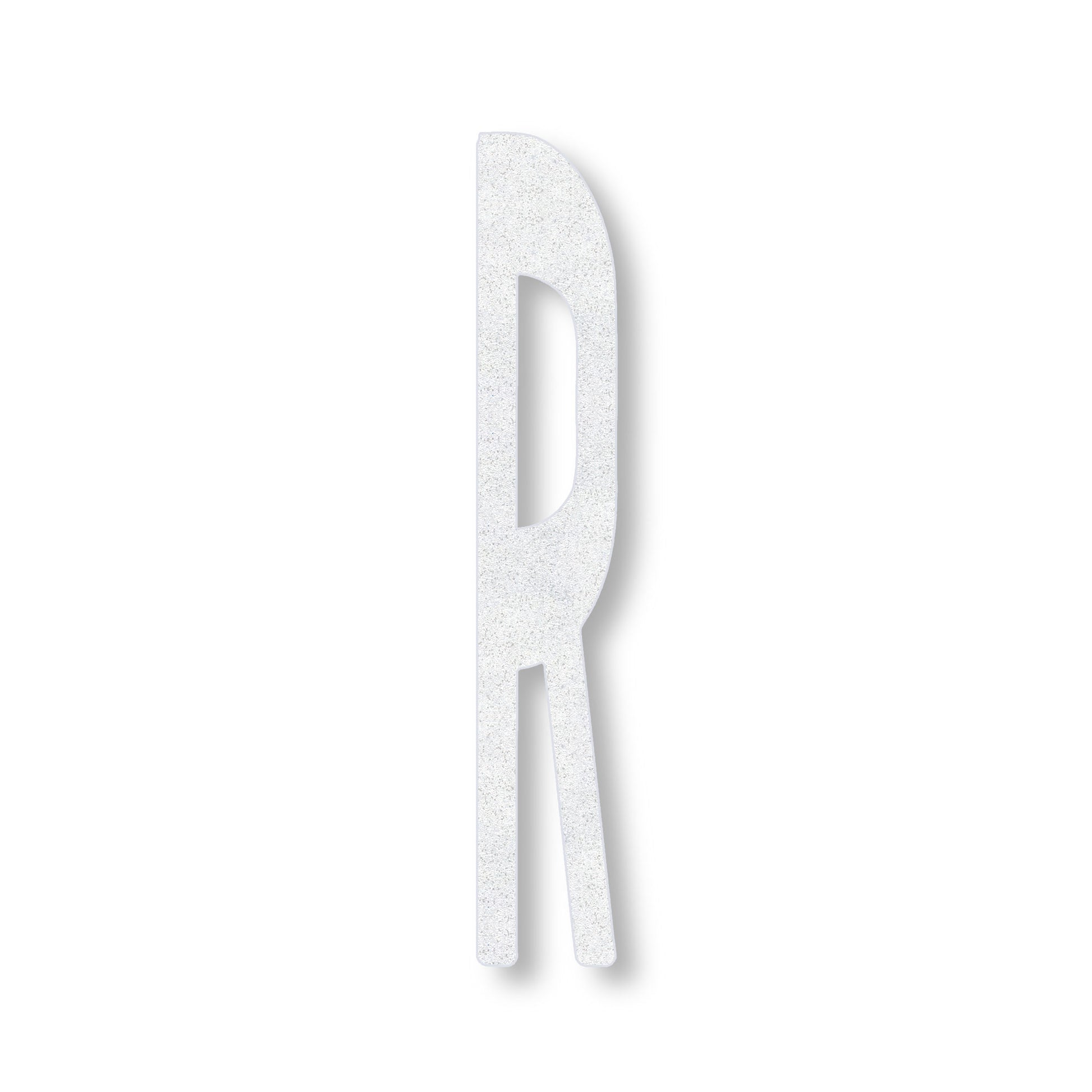 A white preformed thermoplastic letter 6' R