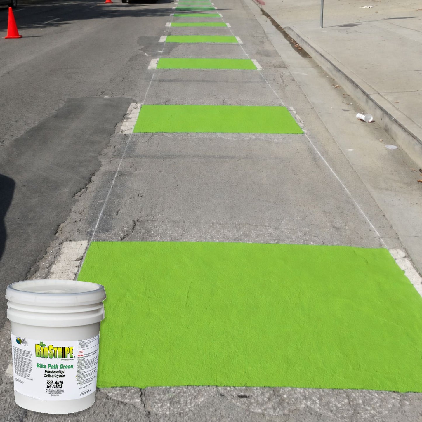 Bright green bike path crossing markings painted on concrete pavement using BioStripe Bike Path Green Waterborne Alkyd Traffic Safety Paint.
