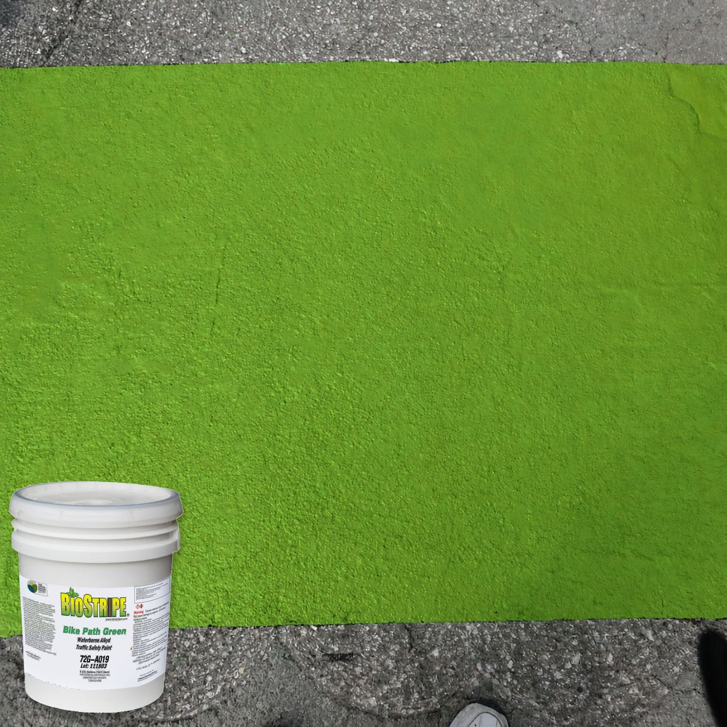 Bright green bike lane surface coating applied to pavement using BioStripe Bike Path Green Waterborne Alkyd Traffic Safety Paint.