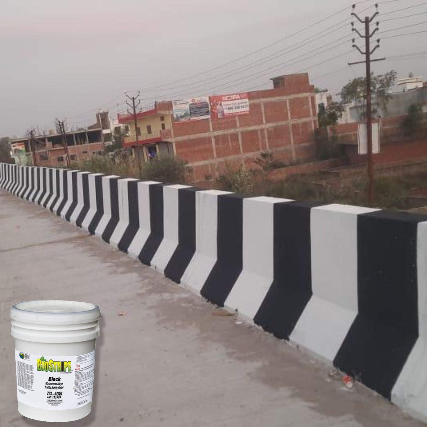 BioStripe Black Waterborne Alkyd Traffic Safety Paint used for high-contrast black-and-white concrete barrier striping to improve roadway visibility and traffic guidance.