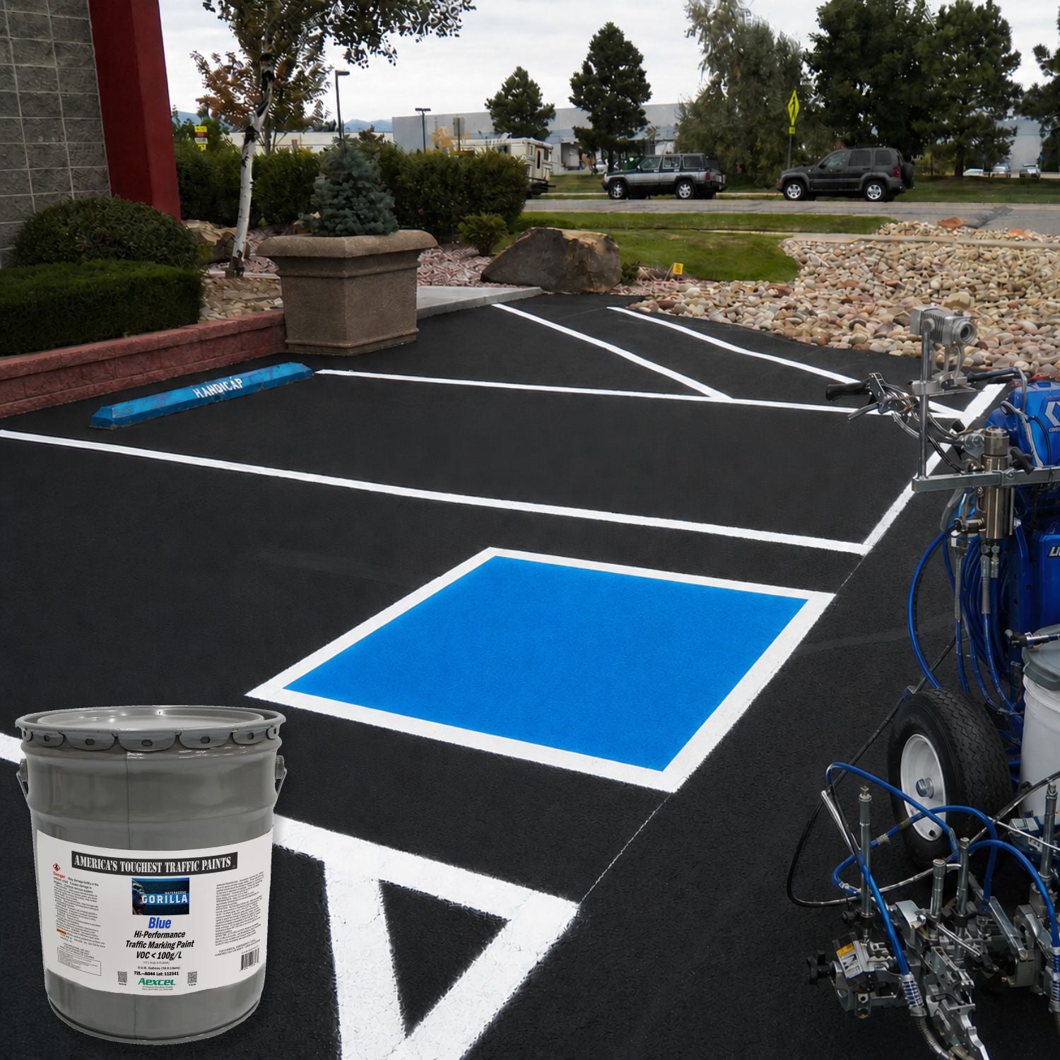 Blue handicap parking space markings applied on asphalt using Aexcel Gorilla blue traffic marking paint and striping equipment.