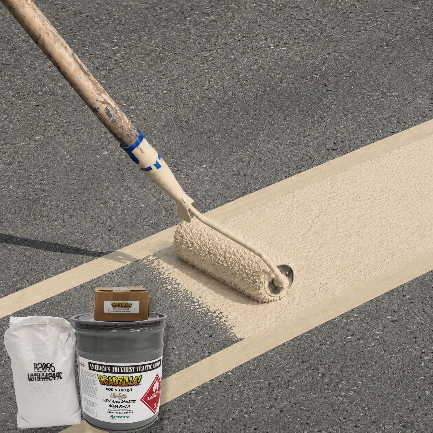 RoadZilla Beige MMA high-friction surfacing being roller-applied to pavement, creating a durable, slip-resistant decorative lane marking for enhanced pedestrian and traffic safety.