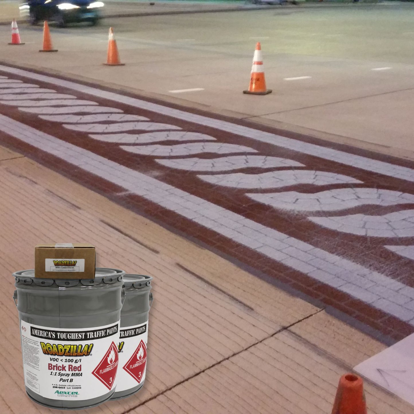 RoadZilla Brick Red MMA Traffic Marking Paint applied to a decorative roadway median featuring a brick-pattern design, providing durable, fast-curing pavement markings for high-traffic urban intersections.