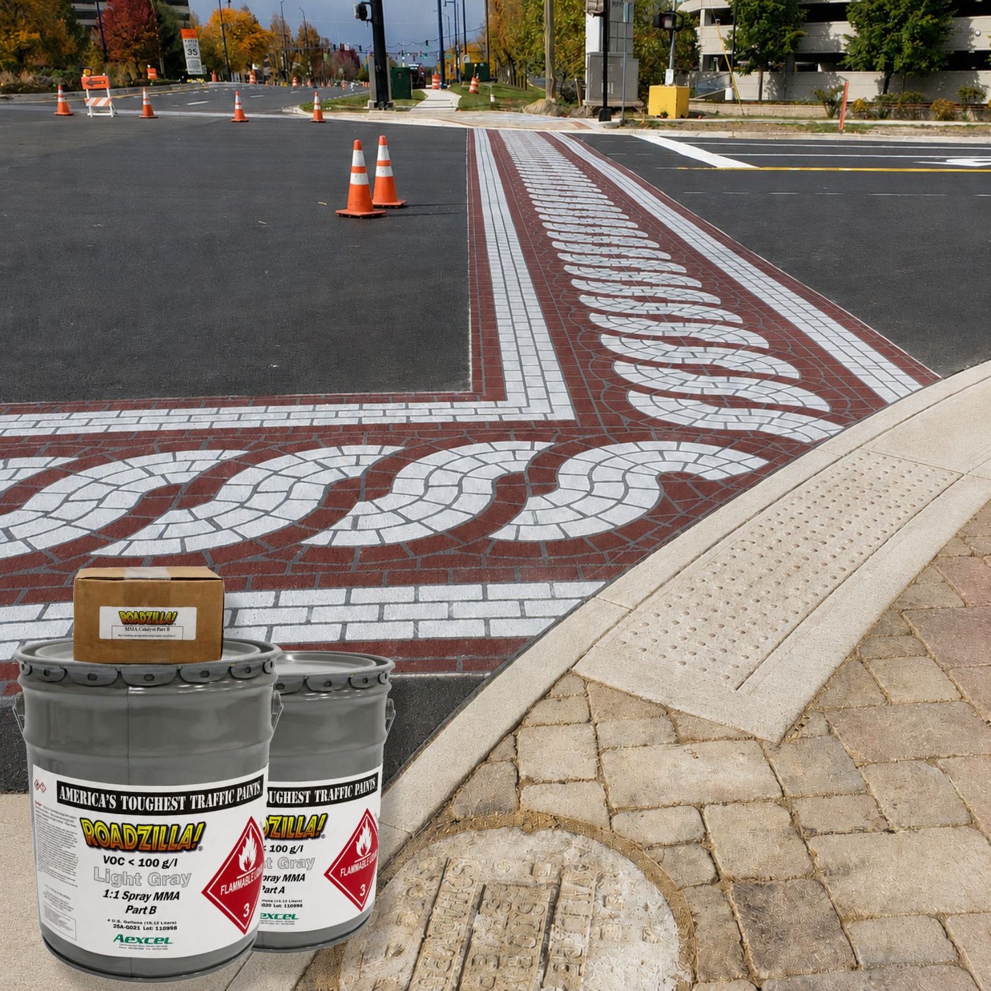 RoadZilla MMA decorative pavement marking system installed at an intersection crosswalk featuring brick-pattern graphics and durable long-lasting roadway markings.