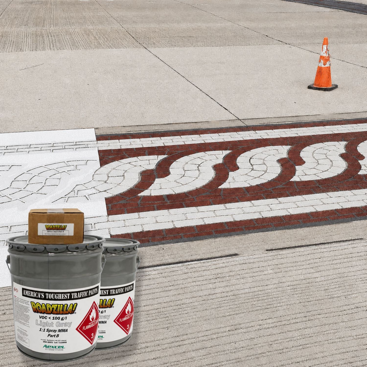 RoadZilla MMA pavement marking system applied to decorative concrete crosswalk with high-durability white and gray markings for pedestrian safety and streetscape enhancement.