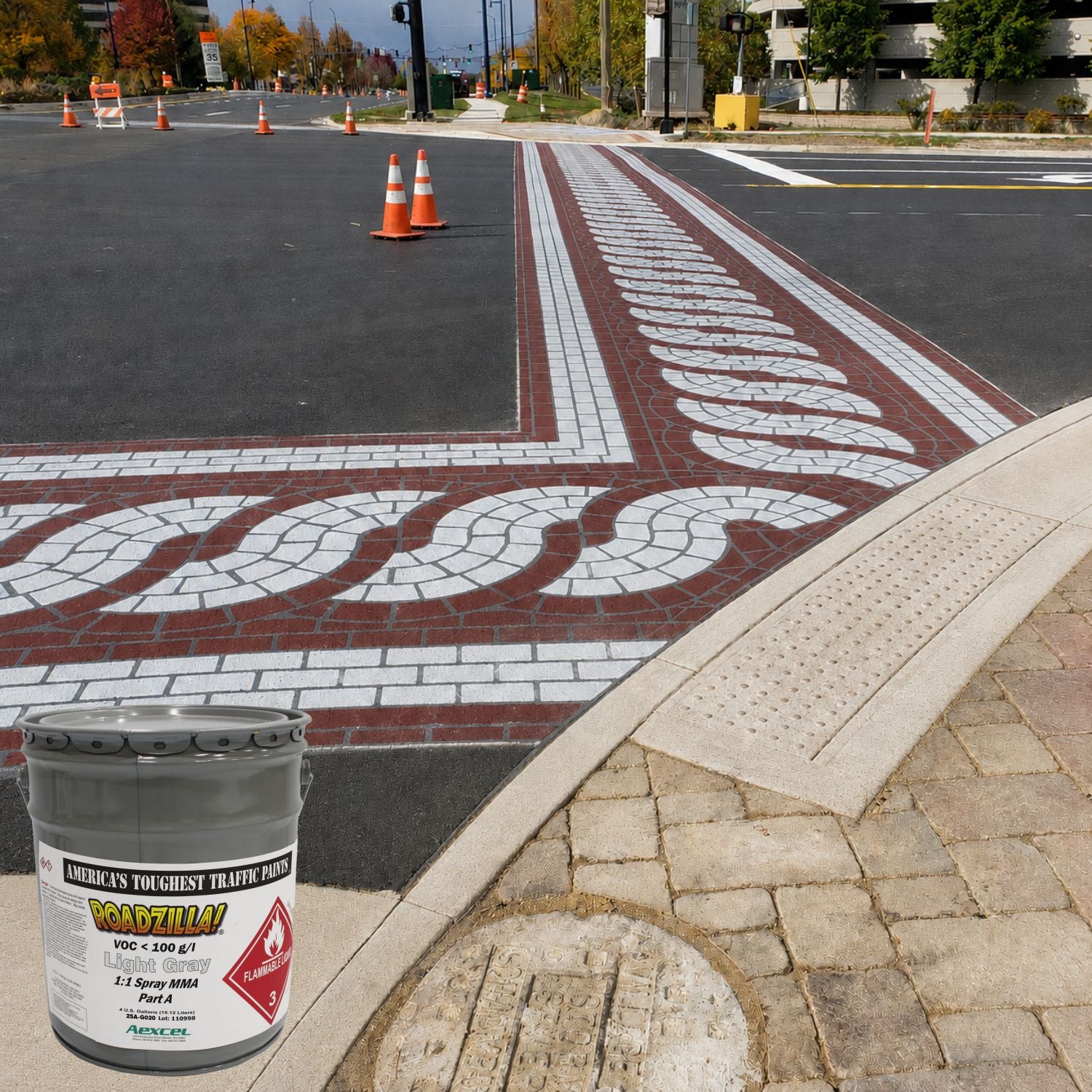 Decorative crosswalk pavement markings created with RoadZilla Light Gray MMA traffic marking paint at a roadway intersection.