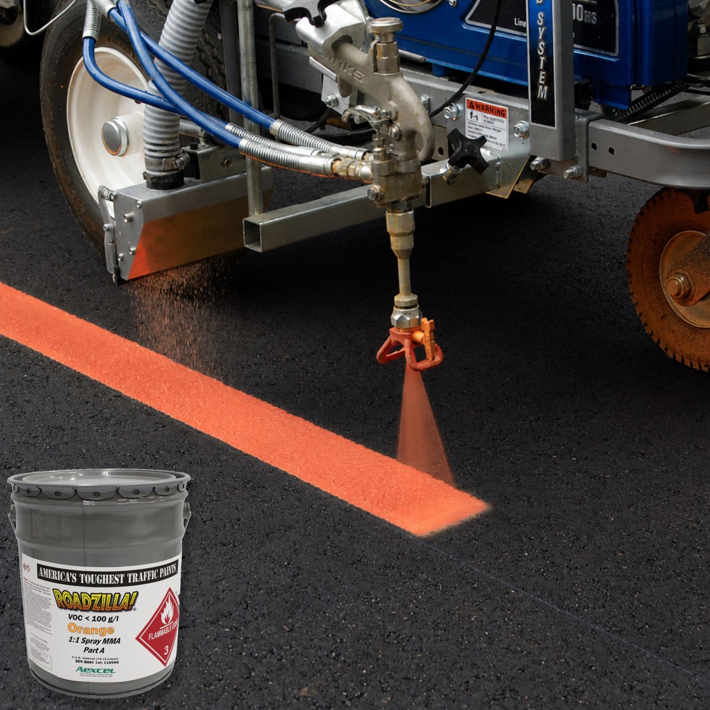 RoadZilla Orange MMA traffic marking paint being applied with a 1:1 plural-component spray machine to create a high-visibility orange pavement line on asphalt.