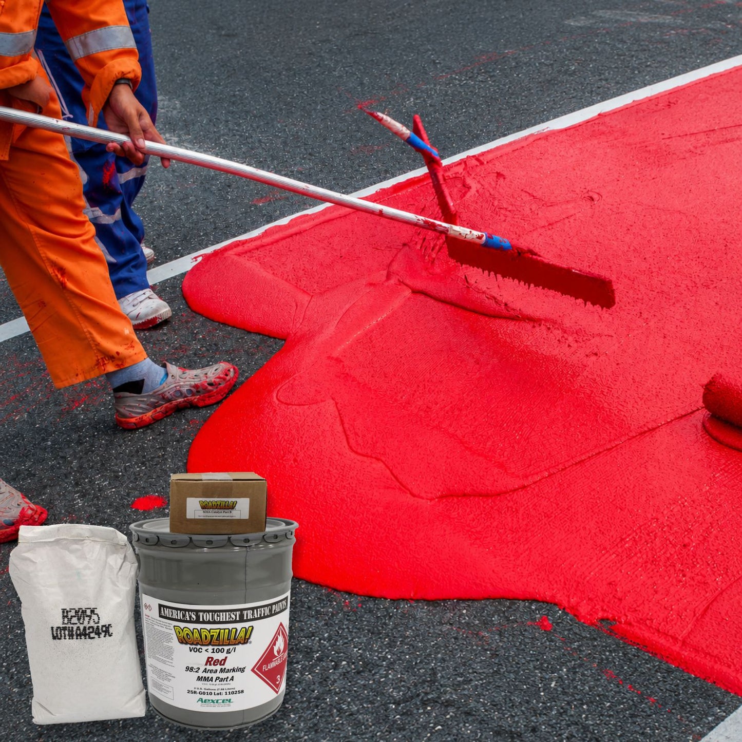 RoadZilla Red MMA Area Marking System components displayed beside a crew applying a bright red high-friction pavement surface.