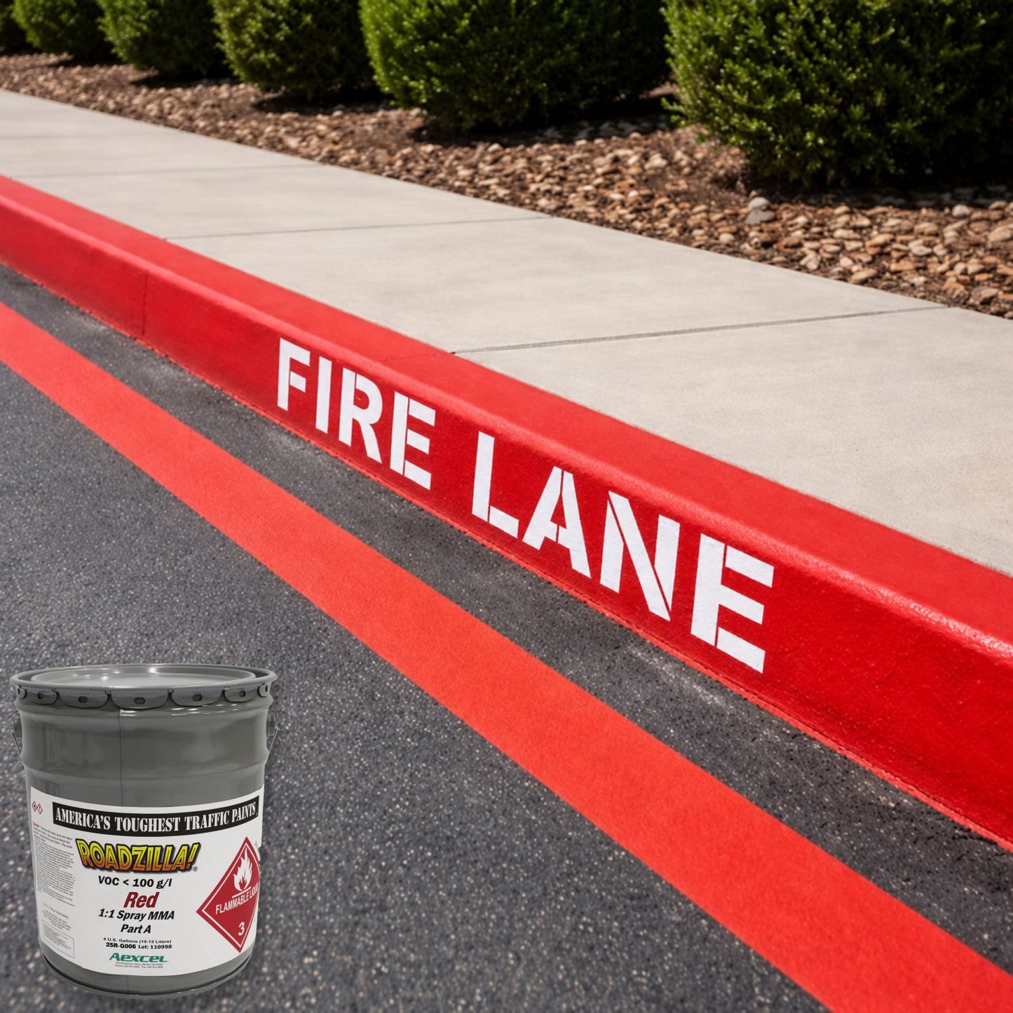 RoadZilla Red MMA traffic marking paint shown beside a bright red fire lane curb with bold white FIRE LANE lettering and matching red pavement stripe, demonstrating high-visibility safety markings.