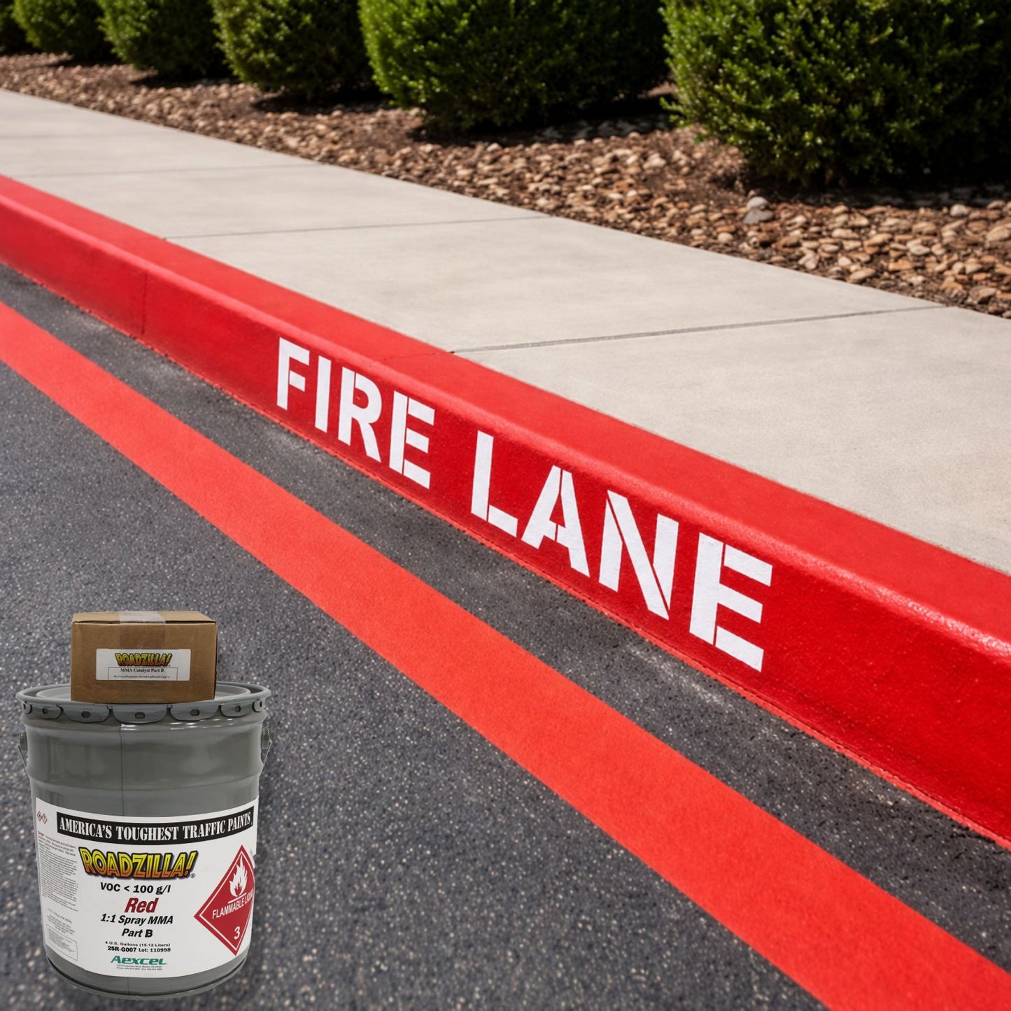 RoadZilla Red MMA traffic marking paint used for fire lane striping and red-painted curbs with crisp white FIRE LANE lettering.