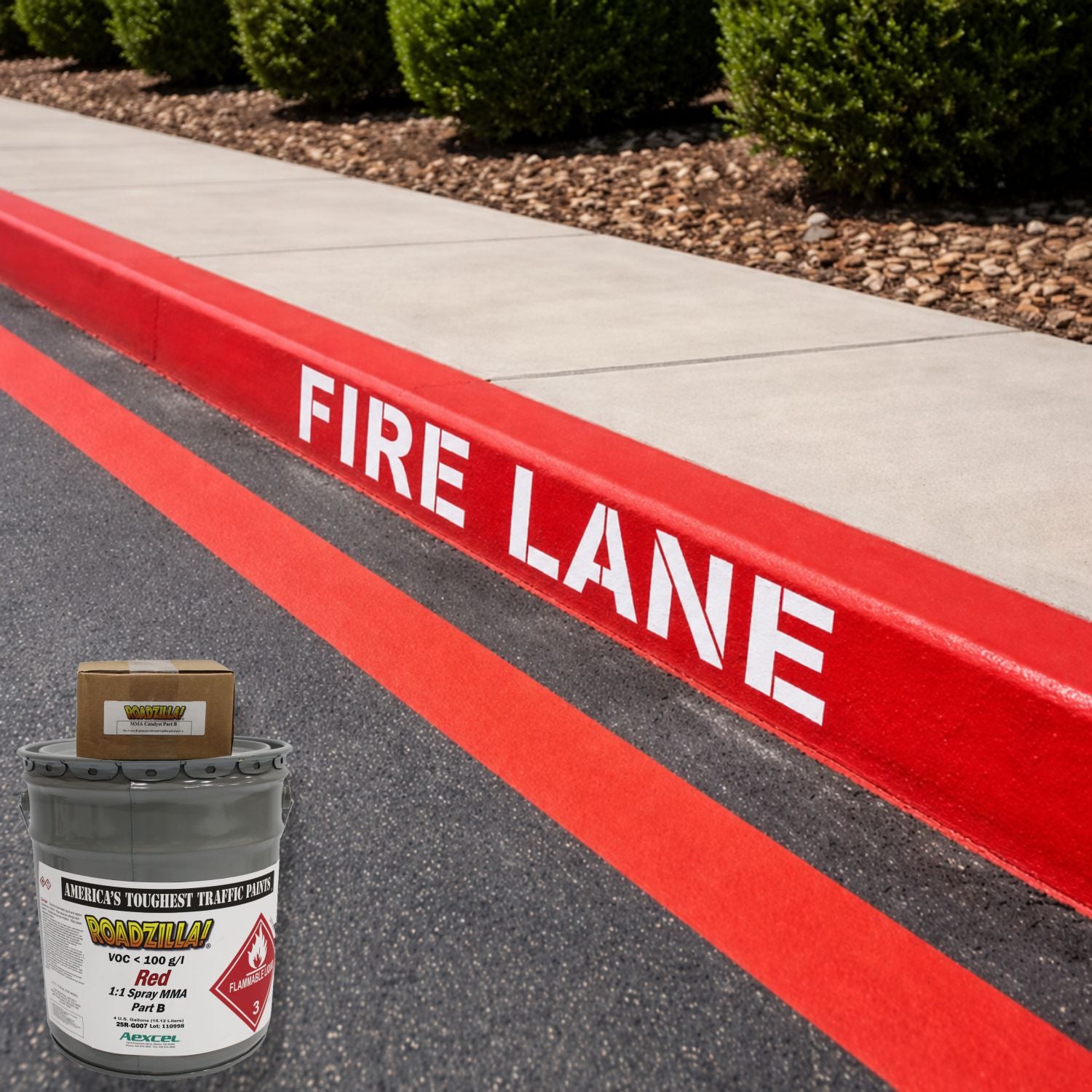 RoadZilla Red MMA traffic marking paint used for fire lane striping and red-painted curbs with crisp white FIRE LANE lettering.