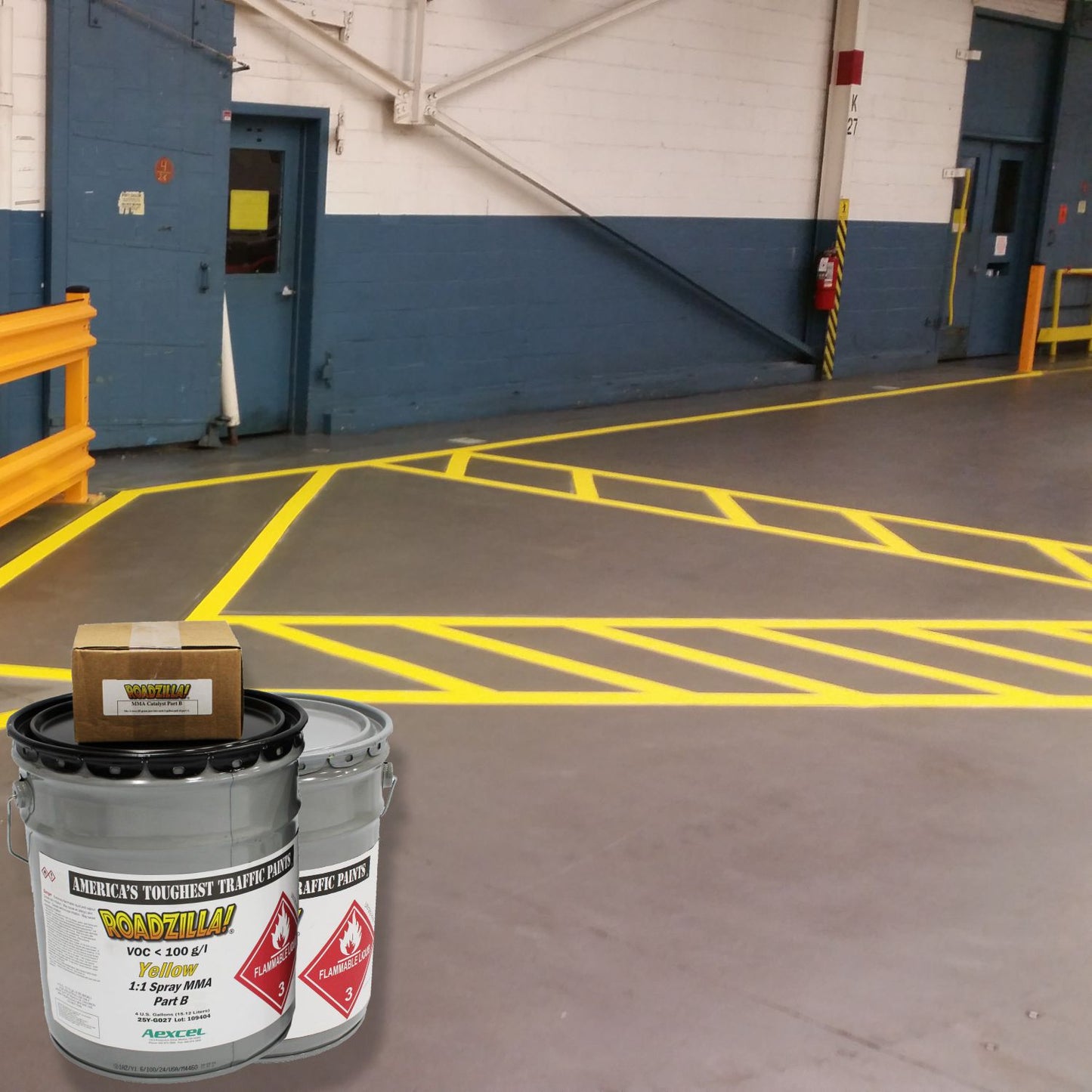 RoadZilla Yellow MMA Traffic Marking Paint used to create high-visibility yellow safety striping and crosshatched hazard zones inside an industrial facility, improving traffic flow and workplace safety.