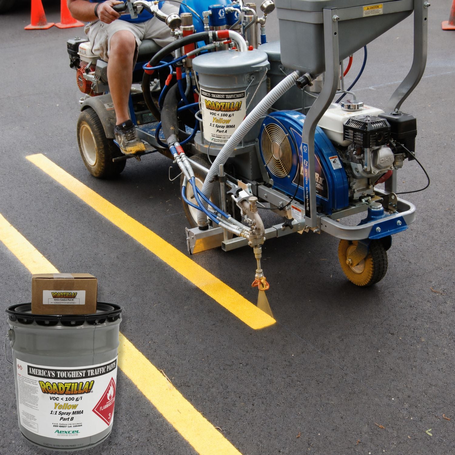 RoadZilla Yellow MMA traffic marking paint being applied with a plural-component striping machine to create bright yellow pavement lines on new asphalt. The image showcases professional spray application and high-visibility lane markings for parking lots, roadways, and industrial facilities.