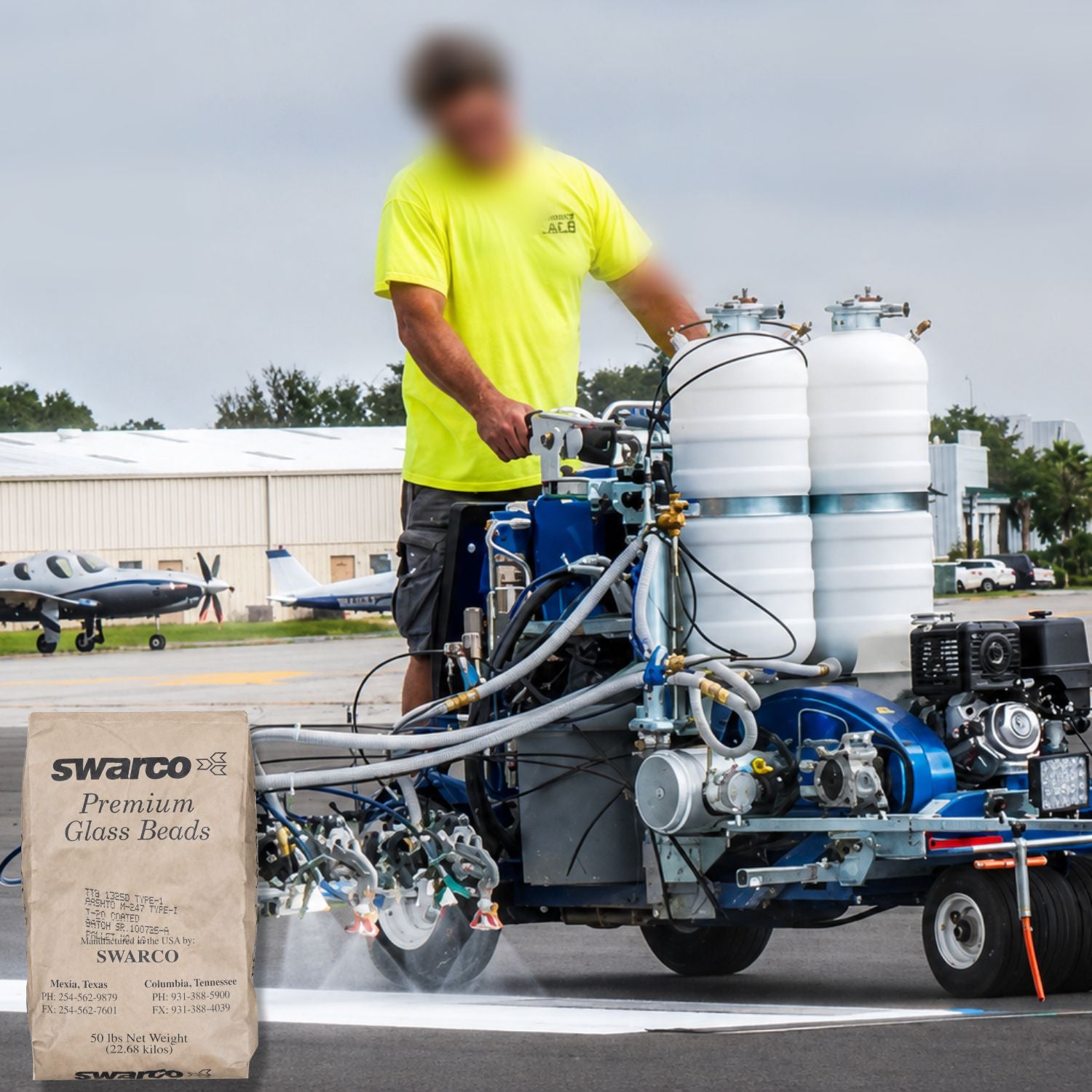 SWARCO Premium Glass Beads being applied with a pavement marking truck during runway striping, enhancing nighttime reflectivity and traffic safety markings.
