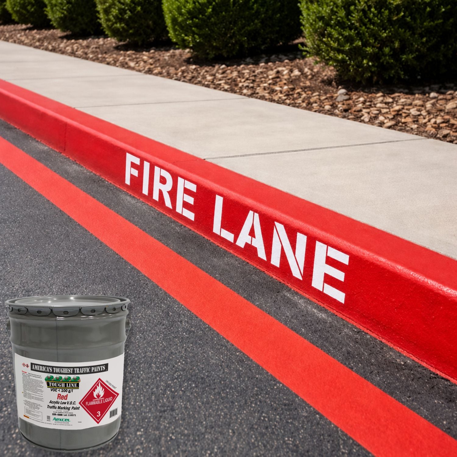 Red-painted fire lane curb and roadway edge markings with white "FIRE LANE" lettering, applied using Aexcel Acrylic Traffic Marking Paint for high visibility and safety compliance.